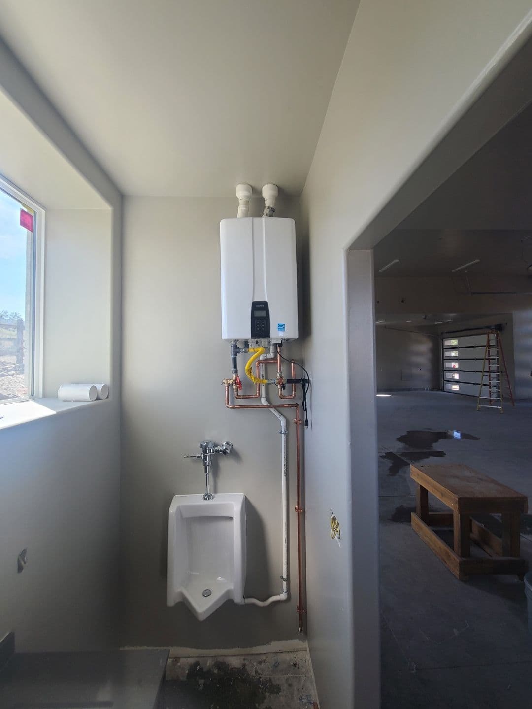 Efficient Tankless Water Heater Installed in a Garage image